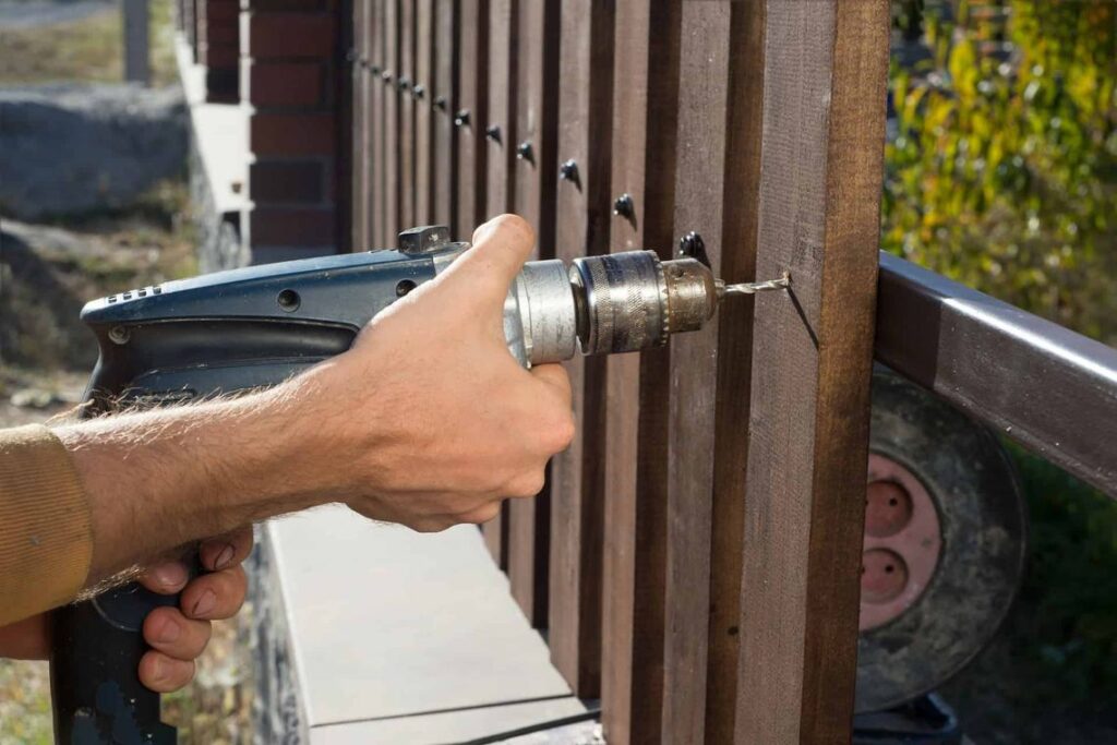 DIY Fencing wood fencing installed with a drill