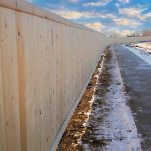 commercial wood fencing installed in a new community. Commercial fencing in Lethbridge provided by DH fencing